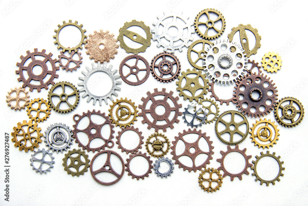 Group of gears on a light background. The background of the gears. Group of gears on a light background. The background of the gears.