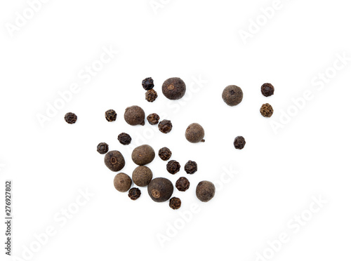 Scattered allspice and pepper isolated on white background