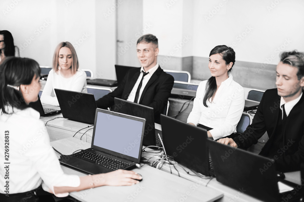 business woman holds a seminar with a business team. business woman holds a seminar with a business team.