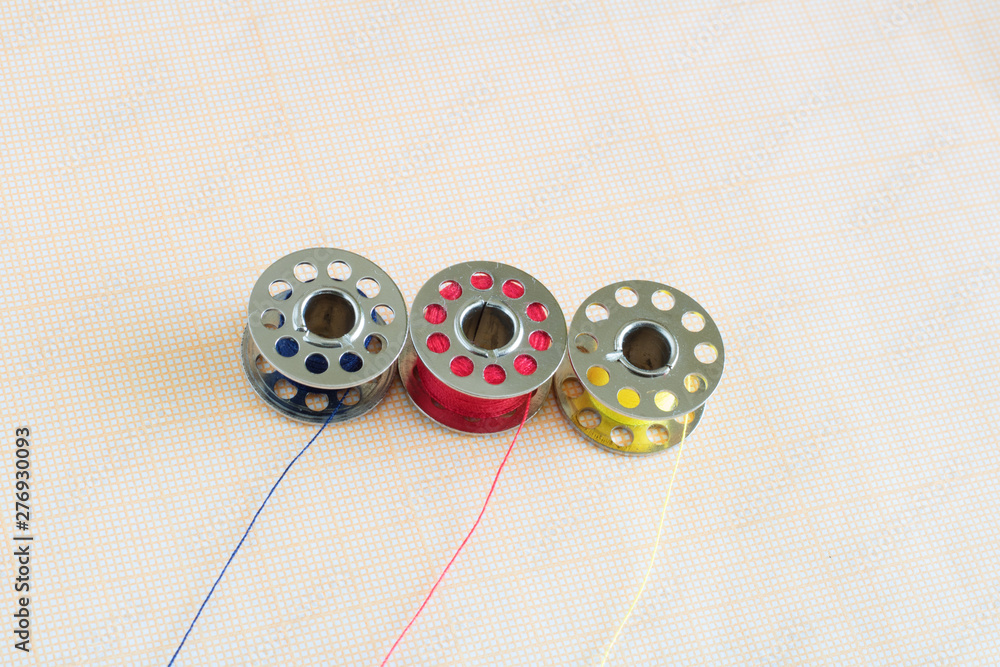 spools of thread close up, sewing supplies, place for text