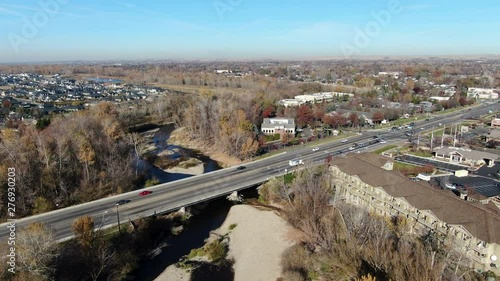 Boise River flowing under a bridge in Eagle, Idaho photo