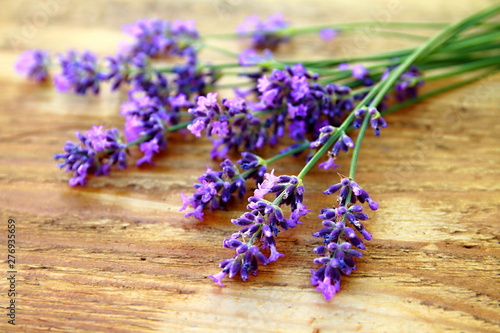 lavender flower displayed and sitting on a wooden table no people stock photo