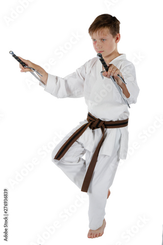 Teenage boy doing martial arts photo