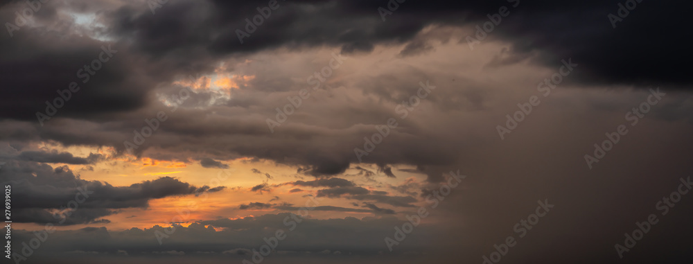 Dramatic Panoramic View of a cloudscape during a dark and colorful sunset. Taken over Havana, Cuba.