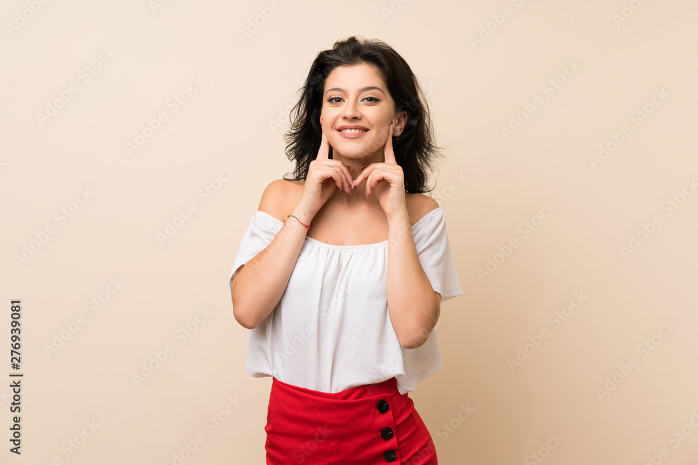 Young woman over isolated background smiling with a happy and pleasant expression Young woman over isolated background smiling with a happy and pleasant expression