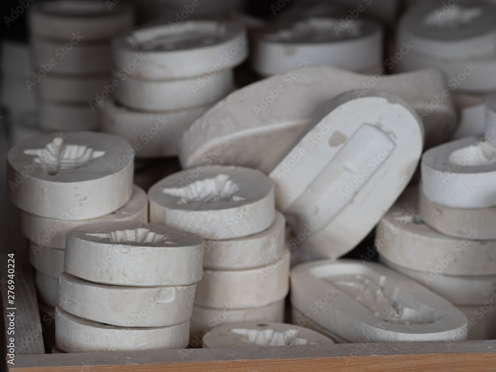 Plaster moulds for making clay sculptures in a workshop. Moulding a shape Plaster moulds for making clay sculptures in a workshop. Moulding a shape