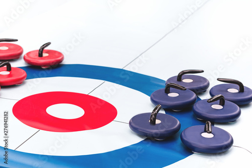 Fotografering Floor curling sheet with red and blue roller stones for fun indoors or outdoor sport and entertainment activities and kids play