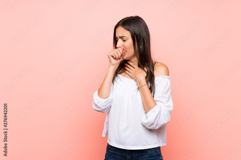 Young woman over isolated pink background is suffering with cough and feeling bad Young woman over isolated pink background is suffering with cough and feeling bad