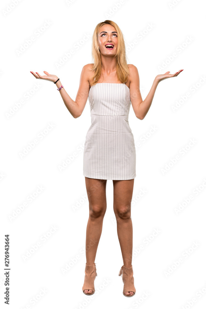 A full-length shot of a Young blonde woman smiling a lot over isolated white background A full-length shot of a Young blonde woman smiling a lot over isolated white background