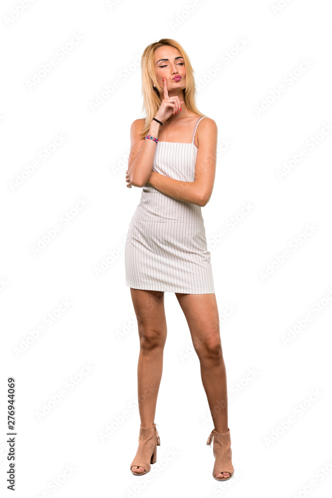A full-length shot of a Young blonde woman Looking front over isolated white background A full-length shot of a Young blonde woman Looking front over isolated white background