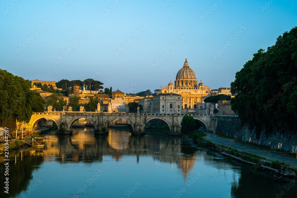 Sunrise at Vatican City Saint Peter Cathedral over the Tiber river in Rome Italy