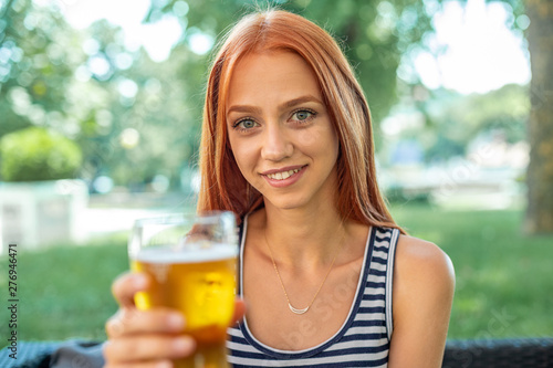 Beautiful Cute Red-hair Women Drinking Beer