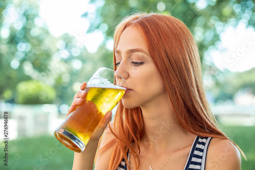 Cute Red-hair Women Drinking Beer
