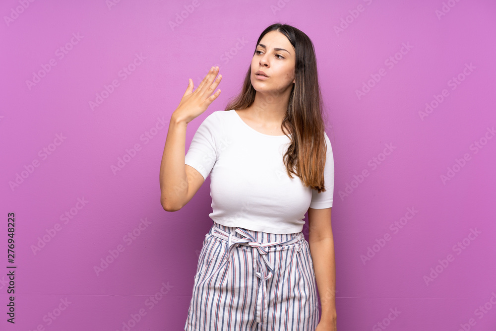 Young woman over isolated purple background with tired and sick expression Young woman over isolated purple background with tired and sick expression