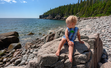 Boy in Acadia National Park on Boulder Beach