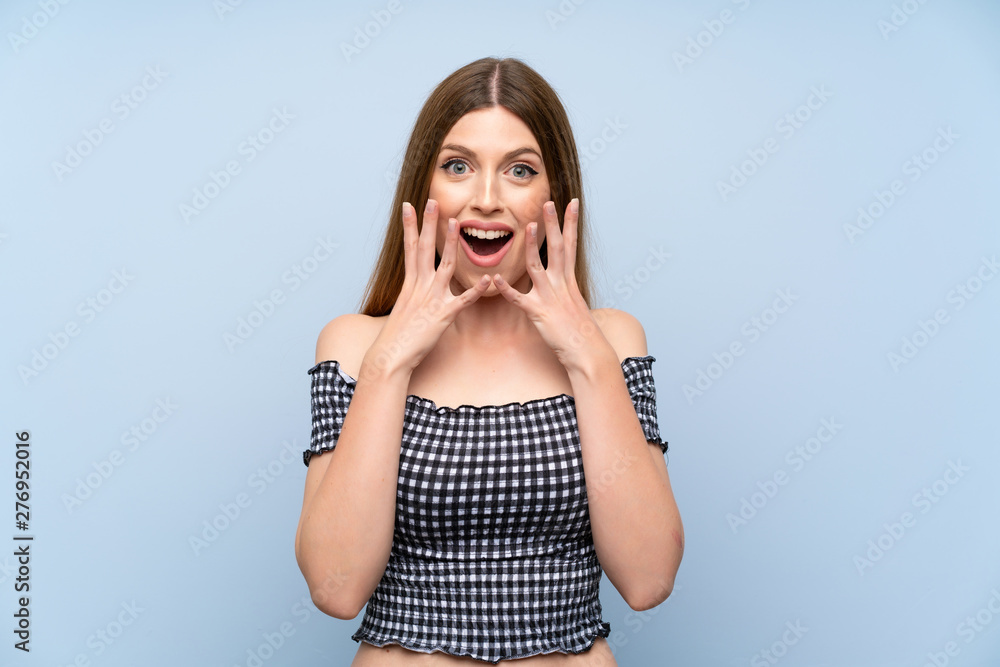 Young woman over isolated blue background with surprise facial expression Young woman over isolated blue background with surprise facial expression