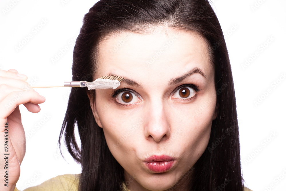 attractive young woman doing makeup