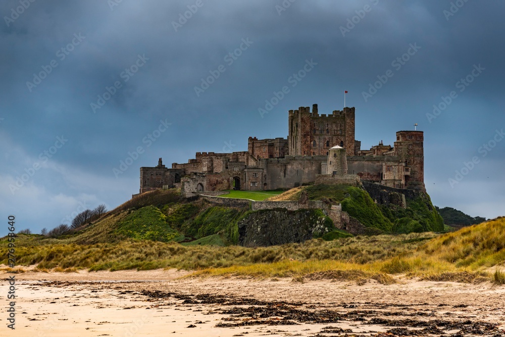 Sandy coast at low tide with Bamburgh Castle, Bamburgh, New Castele upon Tyne, Northumberland, United Kingdom, Europe Sandy coast at low tide with Bamburgh Castle, Bamburgh, New Castele upon Tyne, Northumberland, United Kingdom, Europe