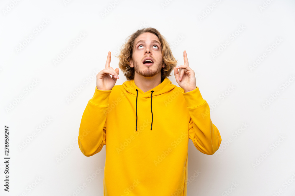Blonde man with sweatshirt over white wall pointing up a great idea Blonde man with sweatshirt over white wall pointing up a great idea