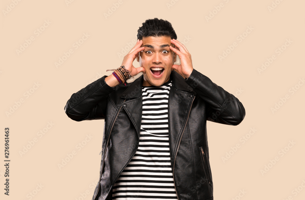 Young man with surprise expression over isolated background Young man with surprise expression over isolated background