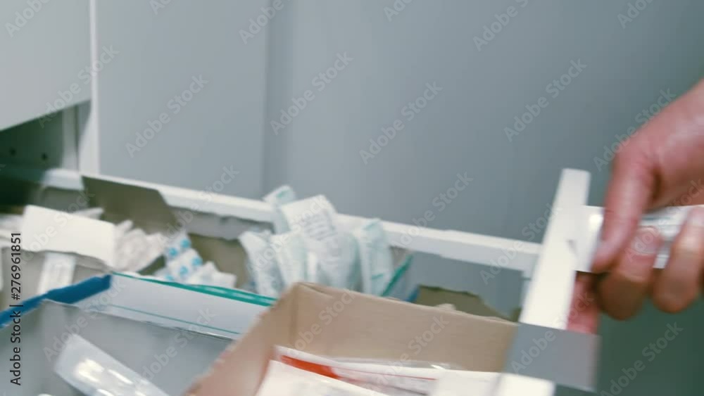 Closeup Of A Veterinarian Closing A Drawer Of Medicine. Closeup Of A Veterinarian Closing A Drawer Of Medicine.