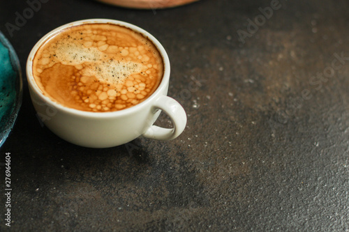 coffee freshly brewed in a white cup serving of beverage (coffee grain). food. top.copy save