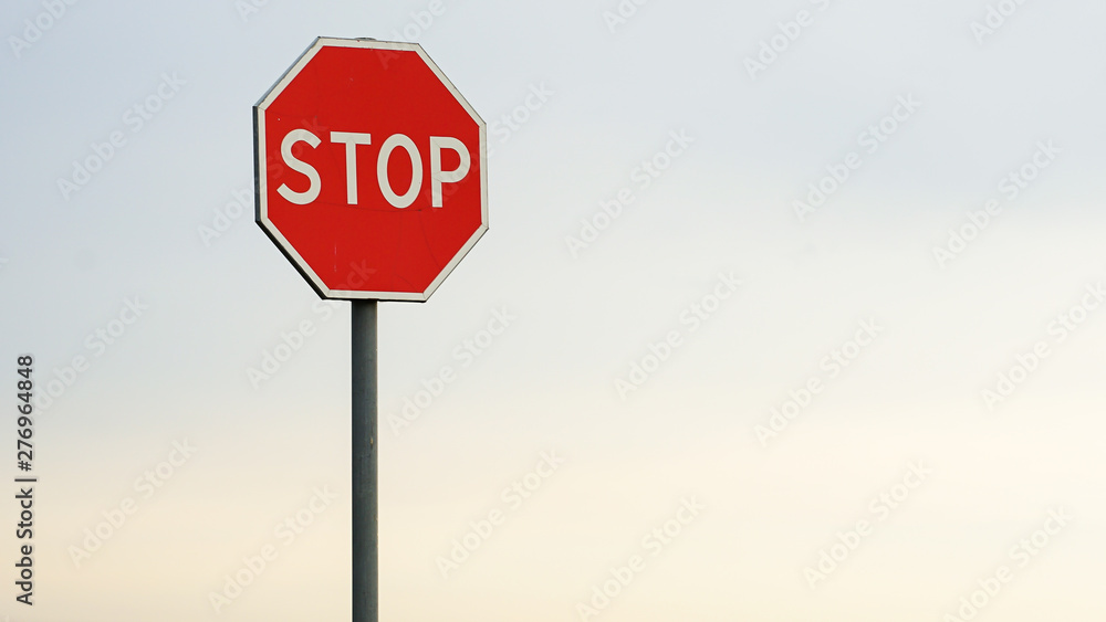 red stop sign, warning signs, over blue sunset sky. red stop sign, warning signs, over blue sunset sky.