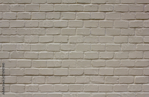 clean gray white brick wall with shadows. rough surface texture
