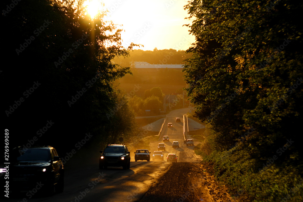 Road to the hill, the movement of vehicles. Sunset evening view Road to the hill, the movement of vehicles. Sunset evening view