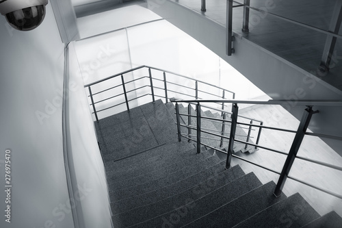 Tablou pe pânză Stone stairs under CCTV camera surveillance, above view