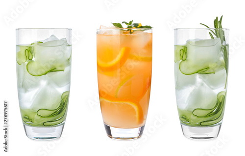 Set of glasses with different refreshing drinks on white background