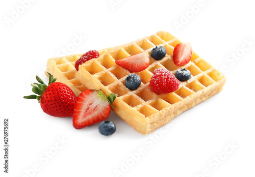Yummy waffles with berries on white background