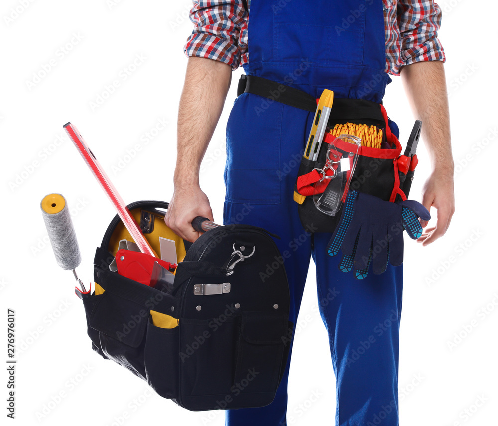 Construction worker with set of tools on white background, closeup Construction worker with set of tools on white background, closeup