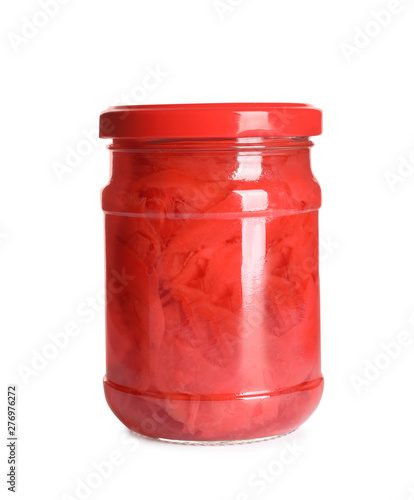 Piquant pickled ginger in glass jar on white background. Delicious sauce condiment