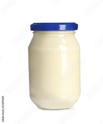 Delicious mayonnaise sauce in glass jar on white background photo