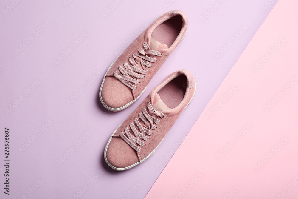Bright stylish shoes on color background, top view Bright stylish shoes on color background, top view