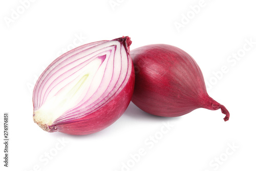 Fresh whole and cut red onions on white background