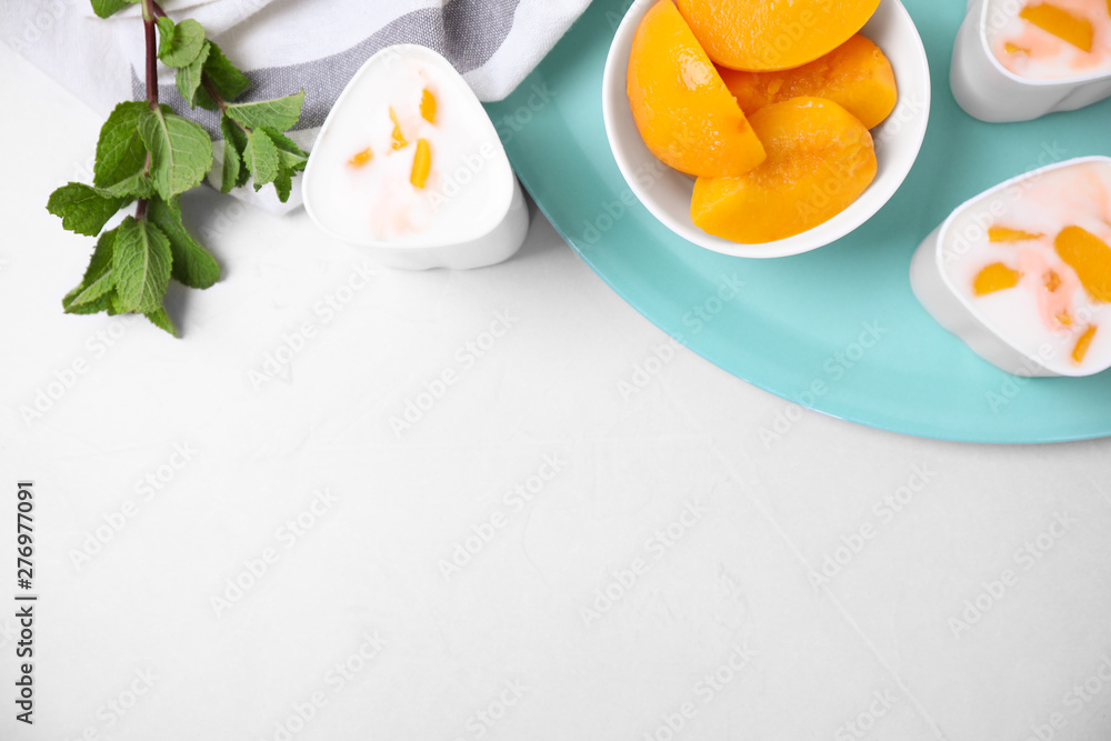 Flat lay composition with yogurt and ingredients on light background, space for text. Multi cooker recipe
