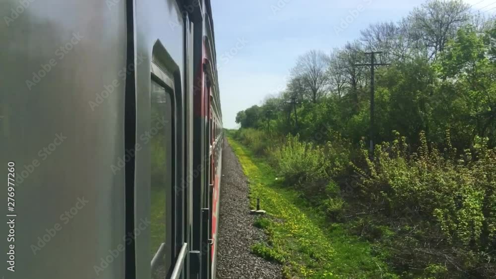 railroad travel concept. locomotive train with passenger wagon carriages moving by rail in nature beautiful view outside. tourism travel lifestyle by the rail railroad travel concept. locomotive train with passenger wagon carriages moving by rail in nature beautiful view outside. tourism travel lifestyle by the rail