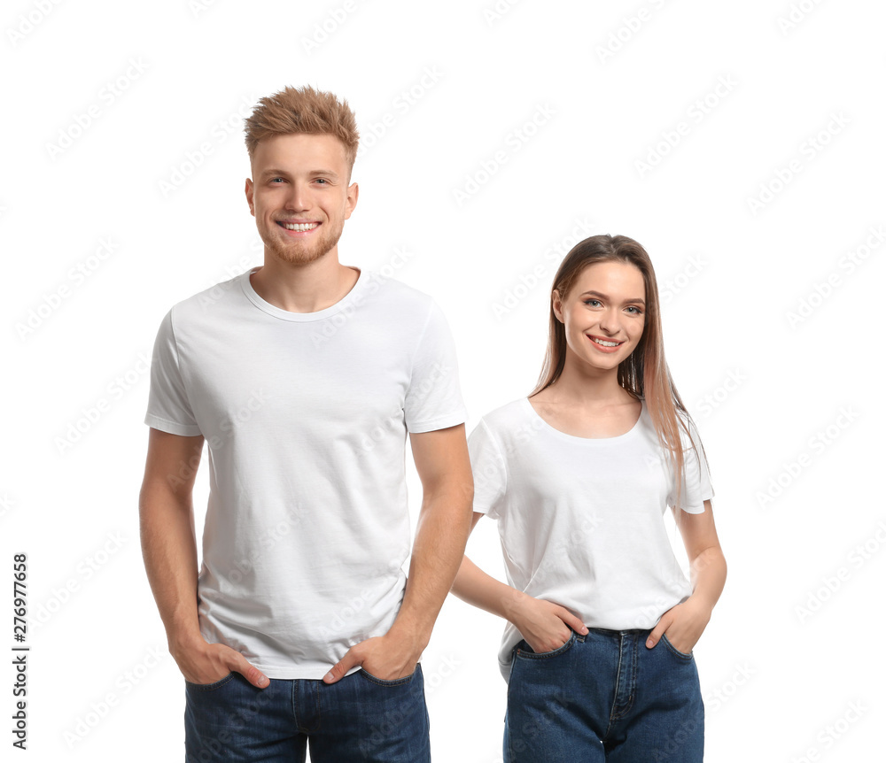 Young couple wearing blank t-shirts isolated on white. Mockup for design Young couple wearing blank t-shirts isolated on white. Mockup for design