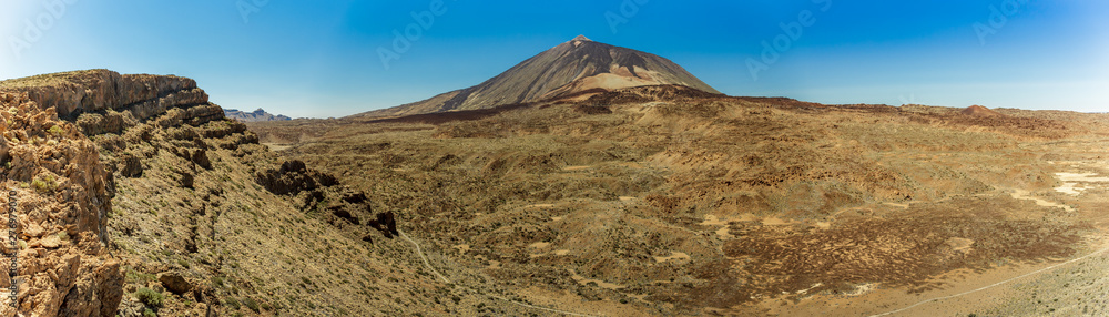 Magnificent panoramic view from the height at the edge of the mountain range around the volcano Teide. National park. Tenerife, Canary Islands, Spain