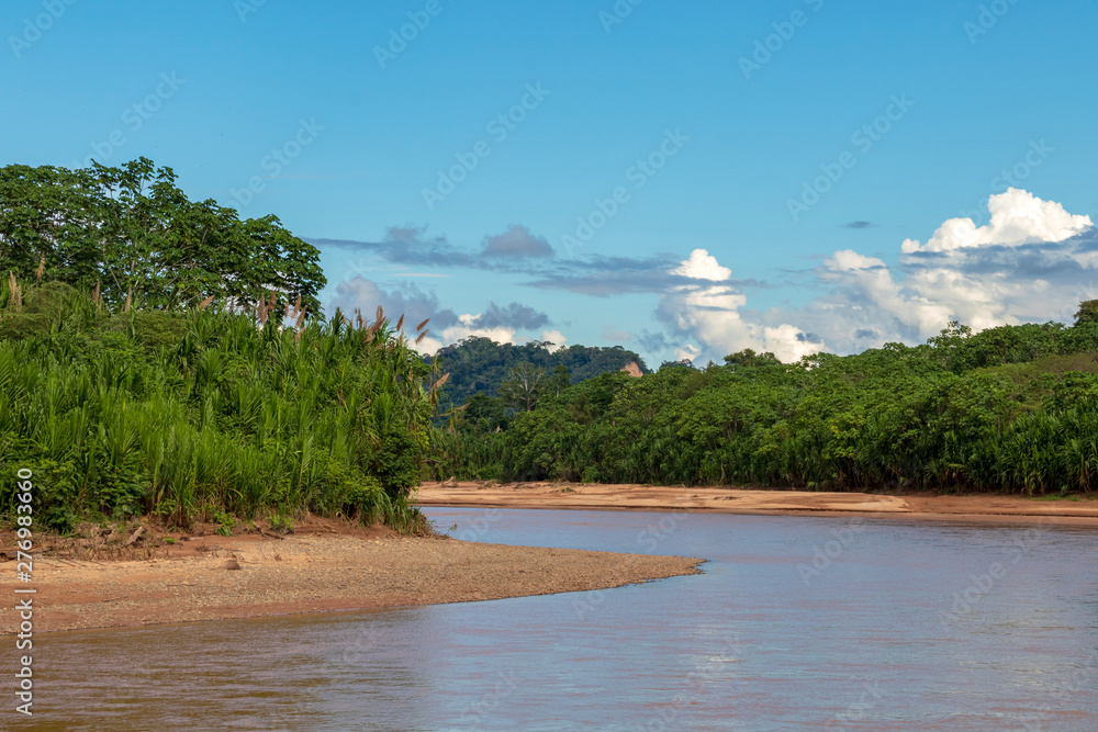 River floating through green Rainforest, Bolivia, Madidi National Park at golden hour