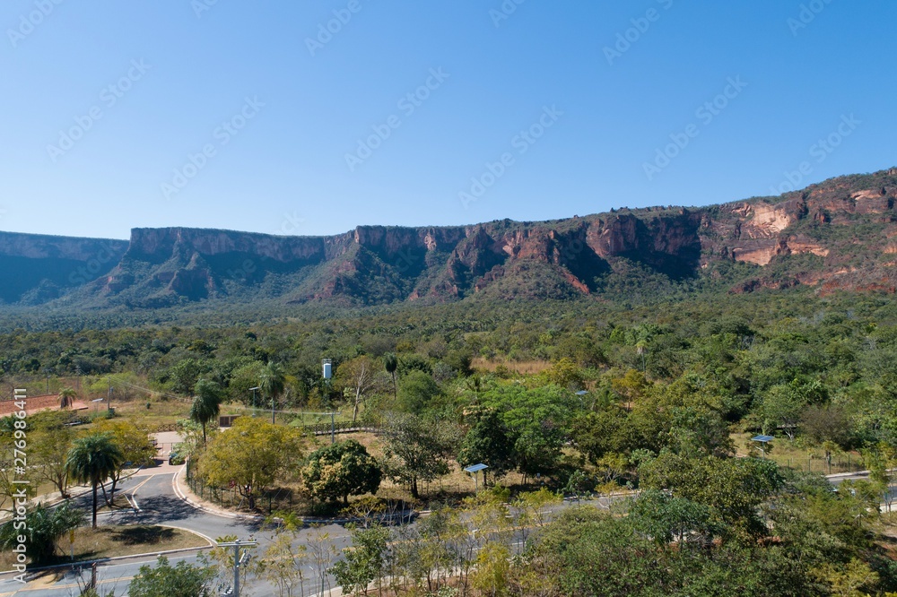 Fototapeta premium Aerial view of MT 241 road, way to Chapada dos Guimarães, Mato Grosso, Brazil. Great landscape. Travel destination. Vacation travel. Touristic point.
