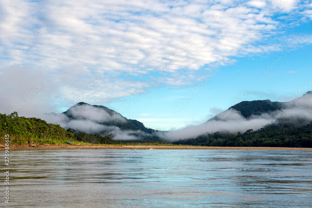 Fototapeta premium Green rainforest mountains in clouds, Amazon river basin, South America