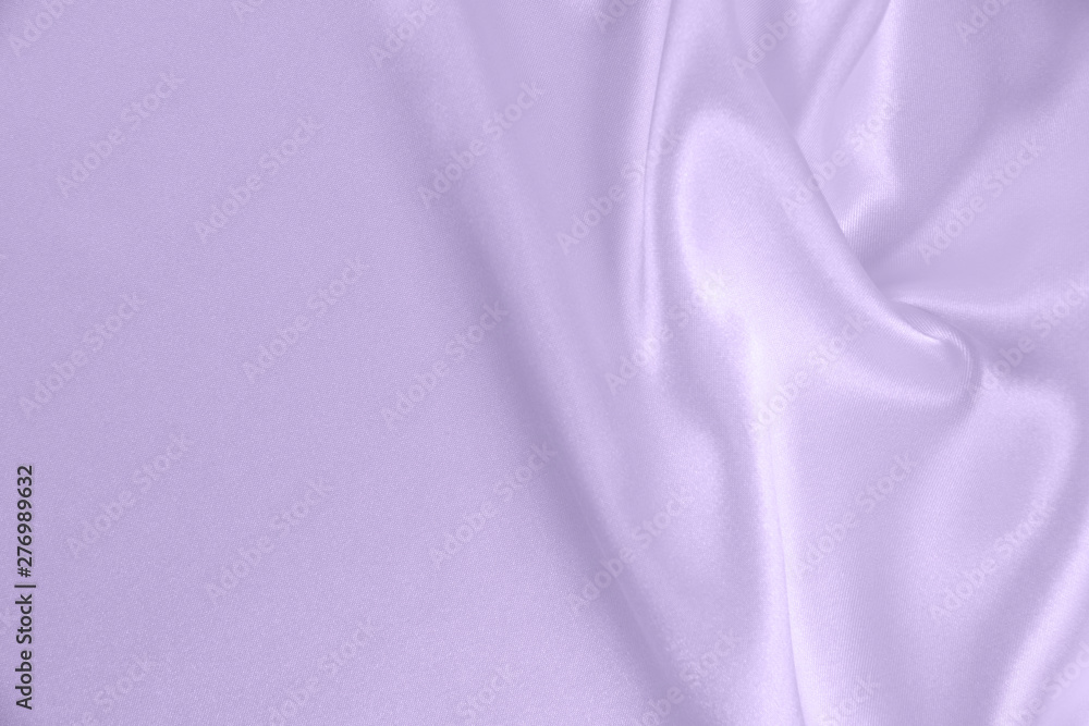 The texture of the satin fabric of lilac color for the background The texture of the satin fabric of lilac color for the background