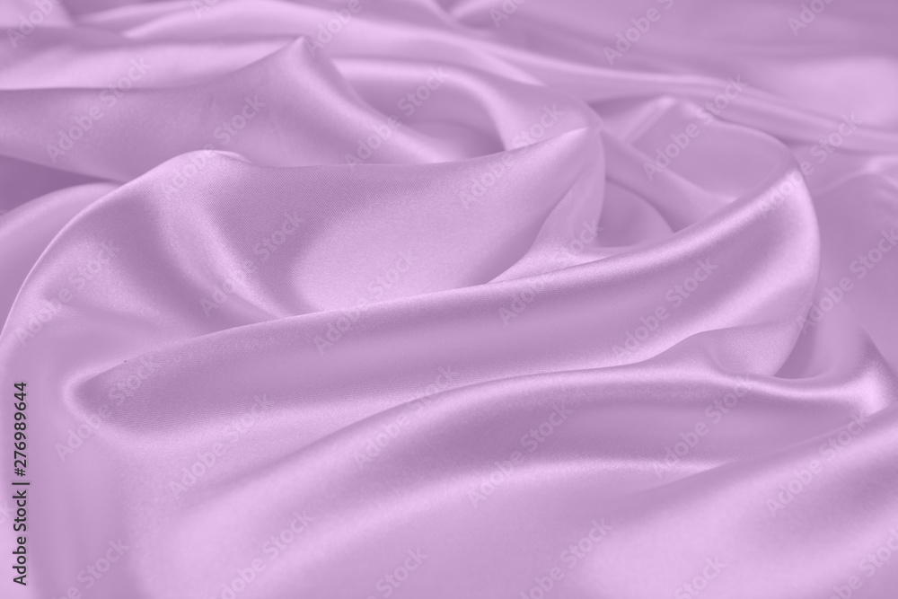 Obraz premium The texture of the satin fabric of lilac color for the background