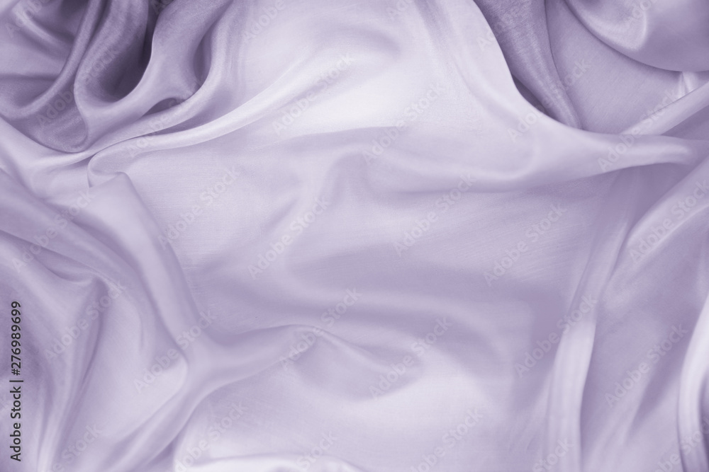 Obraz premium The texture of the satin fabric of lilac color for the background