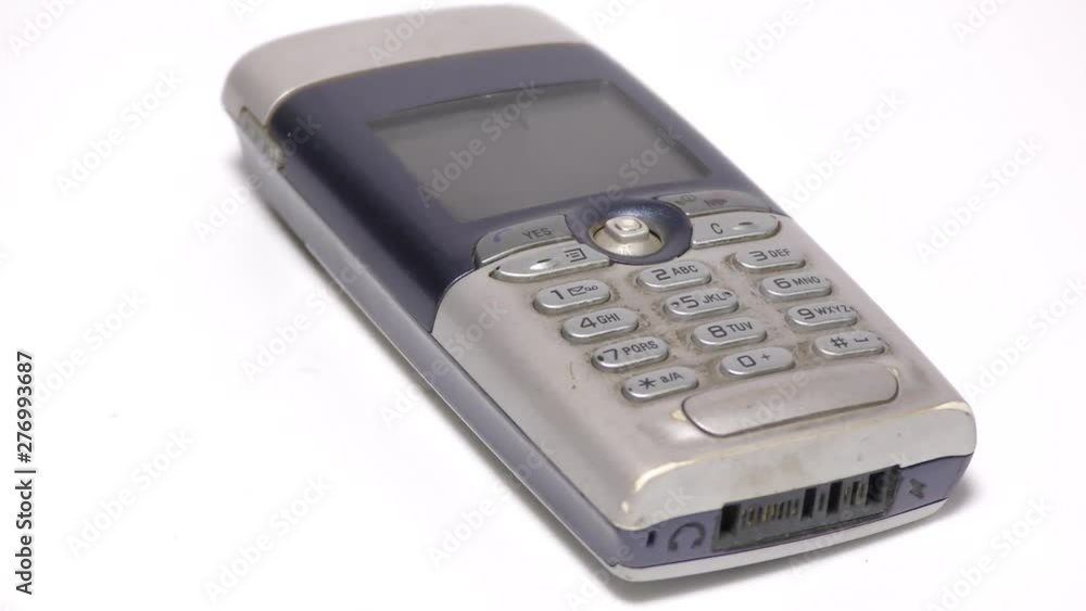 Old mobile with compact design on display Old mobile with compact design on display