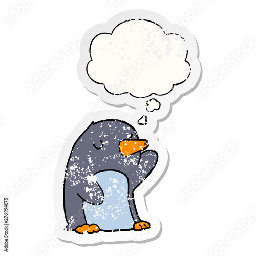 cartoon penguin and thought bubble as a distressed worn sticker