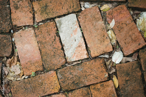 old stone wall of stones , brick laid on the floor